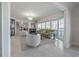 Sun-filled living room with elegant furniture, large windows, and an open design at 7922 Spring Valley Dr, Tampa, FL 33615