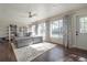 Comfortable living room with backyard views, a ceiling fan, and built in shelves at 7922 Spring Valley Dr, Tampa, FL 33615