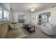 Comfortable living room with stylish furnishings, natural light, and an open view to the dining room at 7922 Spring Valley Dr, Tampa, FL 33615