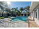 Backyard swimming pool with a building adjacent to the pool at 7922 Spring Valley Dr, Tampa, FL 33615