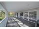 Spacious covered porch with plenty of room to enjoy the outdoors and covered from the elements at 7922 Spring Valley Dr, Tampa, FL 33615