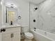 Updated bathroom with marble-look shower, modern fixtures, and a bright vanity area at 8003 W Powhatan Ave, Tampa, FL 33615