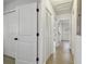 Hallway featuring closet storage and light wood flooring at 8003 W Powhatan Ave, Tampa, FL 33615