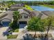 An aerial view showcasing the home's location near a beautiful pond in a quiet neighborhood at 8306 Red Spruce Ave, Riverview, FL 33578