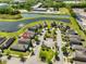 An aerial view highlights this home's location in a charming neighborhood near a pond at 8306 Red Spruce Ave, Riverview, FL 33578
