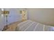 Cozy bedroom with carpeted floors, a lamp, closet, and access to other rooms at 8306 Red Spruce Ave, Riverview, FL 33578