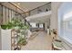 Spacious entryway with a grand staircase, tile flooring, and lots of natural light at 8306 Red Spruce Ave, Riverview, FL 33578