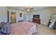 Large main bedroom suite with carpet, natural light and ceiling fan at 8306 Red Spruce Ave, Riverview, FL 33578