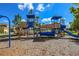 A colorful community playground with slides and climbing structures sits on a mulch surface at 8306 Red Spruce Ave, Riverview, FL 33578