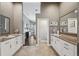 Spacious bathroom featuring dual vanities and an open floorplan that leads into the bedroom at 954 Cobblestone Ln, Tarpon Springs, FL 34688