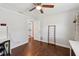 Bright and sunny bedroom features an en suite bathroom and hardwood floors at 954 Cobblestone Ln, Tarpon Springs, FL 34688
