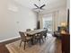 Beautiful dining room with view to the pool and ceiling fan at 954 Cobblestone Ln, Tarpon Springs, FL 34688