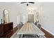 Dining room with hardwood floors, stylish furniture, and modern lighting fixture at 954 Cobblestone Ln, Tarpon Springs, FL 34688