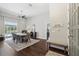 Bright dining room featuring stylish decor, seating for six, and a view of the pool at 954 Cobblestone Ln, Tarpon Springs, FL 34688