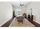 Elegant dining room with hardwood floors and view to the outside at 954 Cobblestone Ln, Tarpon Springs, FL 34688