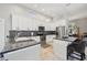 Bright kitchen featuring granite countertops, stainless steel appliances, an island, and breakfast bar at 954 Cobblestone Ln, Tarpon Springs, FL 34688
