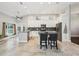 Spacious modern kitchen with stainless steel appliances, large island, and granite countertops at 954 Cobblestone Ln, Tarpon Springs, FL 34688
