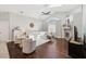 Spacious living room featuring hardwood floors, a brick fireplace, and a vaulted ceiling at 954 Cobblestone Ln, Tarpon Springs, FL 34688