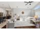 Inviting living room with hardwood floors, open layout, and neutral decor with views to the dining room at 954 Cobblestone Ln, Tarpon Springs, FL 34688