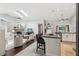 Bright living space connecting to a modern kitchen with a breakfast bar at 954 Cobblestone Ln, Tarpon Springs, FL 34688