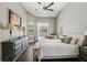 Stylish primary bedroom featuring a decorative lamp and view of the pool area at 954 Cobblestone Ln, Tarpon Springs, FL 34688