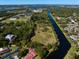 Expansive waterfront property with lush greenery and scenic views of the river at 9554 90Th Ave, Seminole, FL 33777