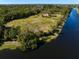 Water view property featuring mature trees and a home, perfect for enjoying waterfront living and nature's beauty at 9554 90Th Ave, Seminole, FL 33777