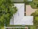 Aerial view of a home featuring a tile roof and a spacious layout surrounded by lush landscaping at 971 Mcfarland St, Dunedin, FL 34698