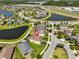 Aerial view of property in a planned community with ponds and green spaces at 10072 Sage Creek Dr, Ruskin, FL 33573