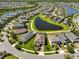 Expansive aerial view of a community with ponds, manicured lawns, and well-maintained homes at 10072 Sage Creek Dr, Ruskin, FL 33573