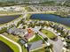 Bird's-eye view highlighting property in community, featuring mature landscaping and water features at 10072 Sage Creek Dr, Ruskin, FL 33573