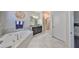 Luxurious bathroom boasting soaking tub, walk-in shower, and modern fixtures at 10072 Sage Creek Dr, Ruskin, FL 33573