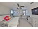 Bright bedroom with a ceiling fan and neutral-colored decor at 10072 Sage Creek Dr, Ruskin, FL 33573