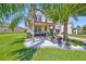 Charming two-story home with a well-manicured lawn and beautiful landscaping at 10072 Sage Creek Dr, Ruskin, FL 33573
