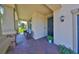 Charming front porch with brick flooring and comfortable seating at 10072 Sage Creek Dr, Ruskin, FL 33573