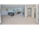 Expansive game room with ample seating, a pool table and a media center for entertainment at 10072 Sage Creek Dr, Ruskin, FL 33573