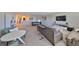 Open-concept game room featuring comfortable sofa and loveseat, media center and pool table at 10072 Sage Creek Dr, Ruskin, FL 33573