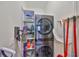 Efficient laundry room equipped with modern washer/dryer and storage shelves at 10072 Sage Creek Dr, Ruskin, FL 33573