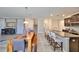 Open concept living space with an eat in kitchen, dining table and stairs nearby at 10072 Sage Creek Dr, Ruskin, FL 33573