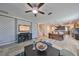 Open-concept living space featuring a ceiling fan and stylish decor at 10072 Sage Creek Dr, Ruskin, FL 33573