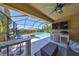 Inviting outdoor living space with a pool, bar area, and covered patio at 10072 Sage Creek Dr, Ruskin, FL 33573
