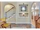 Inviting foyer with arched doorways, niches, and decorative stairway leading to the upper level at 1108 W Charter St, Tampa, FL 33602