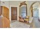 Inviting foyer with tiled floor, wooden accents, natural light, and a clear view to other parts of the house at 1108 W Charter St, Tampa, FL 33602