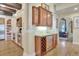 Kitchen wet bar featuring a wine cooler, custom cabinets, granite countertop, and stainless-steel appliances at 1108 W Charter St, Tampa, FL 33602