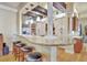 An eat-in kitchen bar features granite countertops, decorative wood beams, and stainless appliances at 1108 W Charter St, Tampa, FL 33602