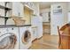 This functional laundry room has built-in cabinets, a granite counter, and sleek appliances at 1108 W Charter St, Tampa, FL 33602