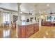 Spacious living area showcasing hardwood floors, decorative columns, and a view of the fireplace and furniture at 1108 W Charter St, Tampa, FL 33602
