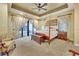 Bright main bedroom featuring a four-poster bed, sitting area, and sliding glass doors to an outdoor spa at 1108 W Charter St, Tampa, FL 33602