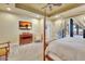 The main bedroom features a large bed, a mounted television, an ensuite bathroom, and access to the outdoors at 1108 W Charter St, Tampa, FL 33602