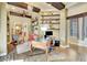 Charming home office with wooden desk, built-in shelves, and decorative lighting, creating a warm workspace at 1108 W Charter St, Tampa, FL 33602